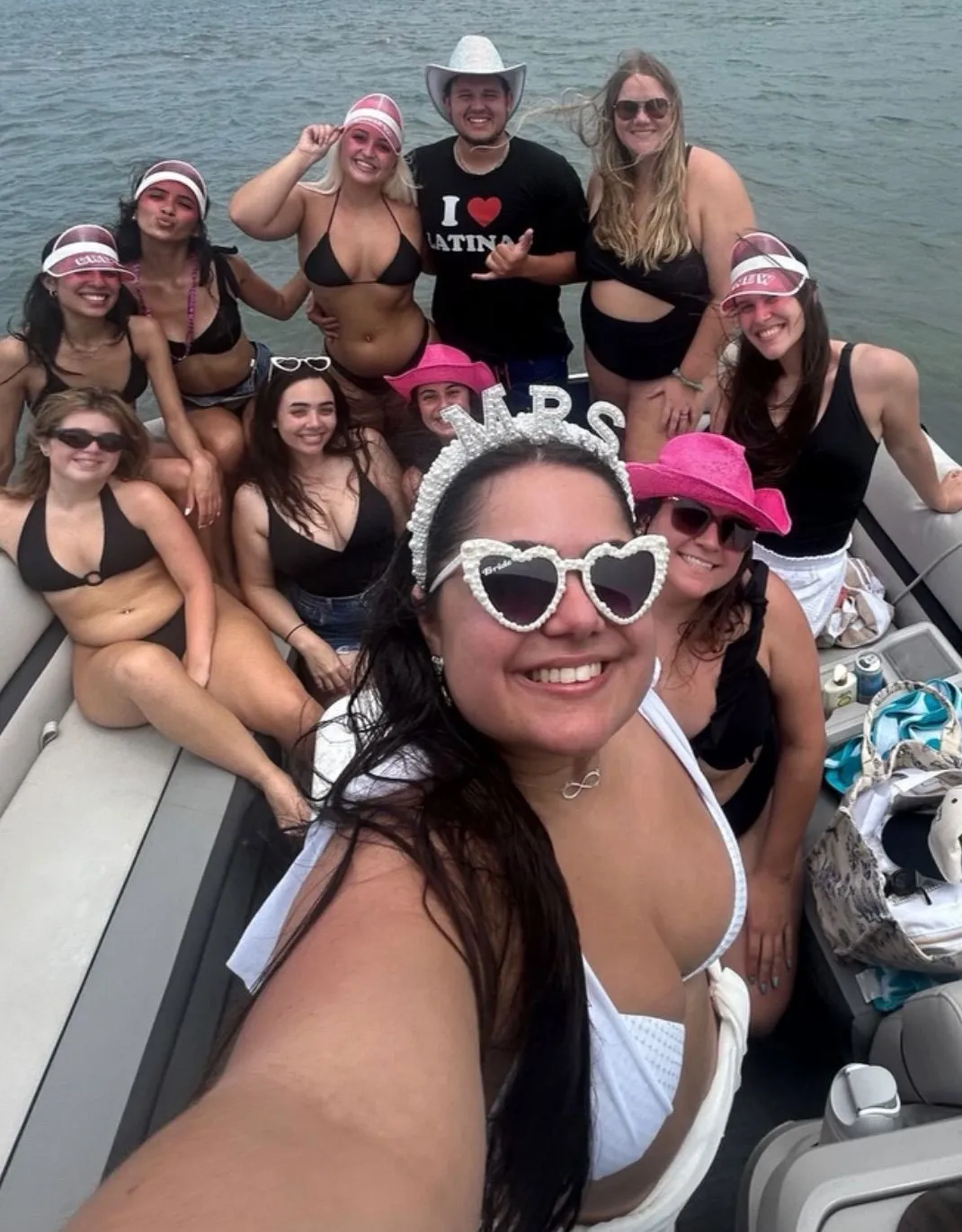 A bachelorette group celebrating together on a boat in Jupiter, Florida